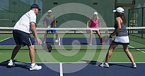 Pickleball - Two Couples Congratulating Each Other After A Game Well Played