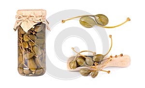 Pickled caper berries in jar isolated on white background. Capers isolated on white background. Pickled capers. Canned