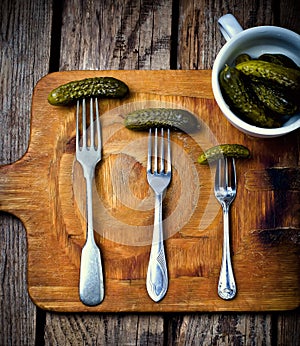 Pickled cucumbers on a fork