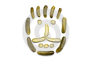 . Pickled cucumbers isolated on a white background. The shape of a human face is made of cucumbers