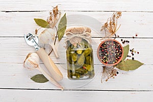 Pickled cucumbers in a jar. Stocks of food. photo