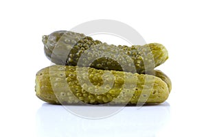 Pickled cucumbers on white background