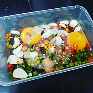 Pickled eggs, fish sauce, chilli and garlic
