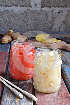 Pickled ginger slices and wooden chopsticks. Ingredient for sushi. Healthy food. Traditional Japanese condiment