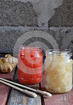 Pickled ginger slices and wooden chopsticks. Ingredient for sushi. Healthy food. Traditional Japanese condiment