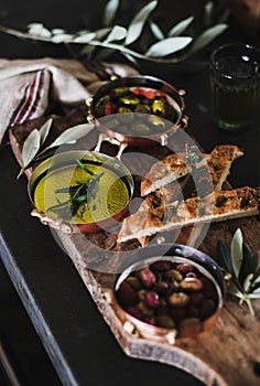 Pickled Greek olives, olive oil and herbed focaccia slices