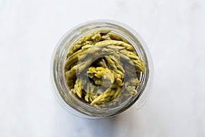 Pickled Green Asparagus Pickles Fermented and Preserved in Glass Bottle Jar.