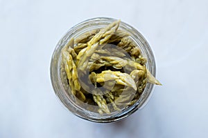 Pickled Green Asparagus Pickles Fermented and Preserved in Glass Bottle Jar.
