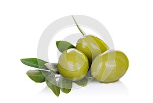 Pickled green olives and olive tree branch on a white photo