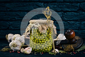 Pickled green peas in a jar. Stocks of food.