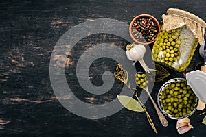 Pickled green peas in a jar. Stocks of food.