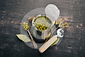 Pickled green peas in a jar. Stocks of food.