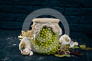 Pickled green peas in a jar. Stocks of food.