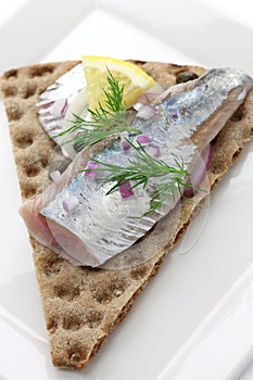 Pickled herring on crisp bread