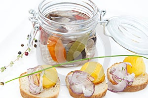 Pickled herring in a glass jar