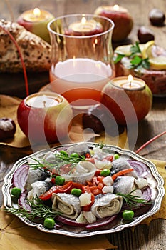 Pickled herring rolls with vegetables