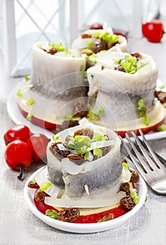 Pickled herring rolls with vegetables