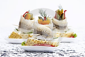 Pickled herring rolls with vegetables