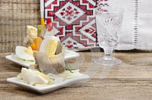 Pickled herring rolls with vegetables