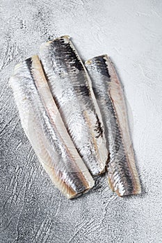 Pickled marinated sea herring fillet. White background. Top view