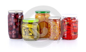 Pickled peach, apricot, cherry, cucumber, lecho lecso, cowhorn chili peppers compote isolated on white with shadow reflection