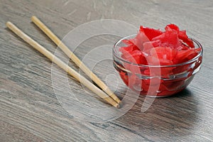 Pickled pink ginger and fresh root on the table