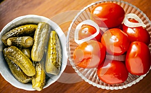 Pickled tomatoes and pickled cucumbers