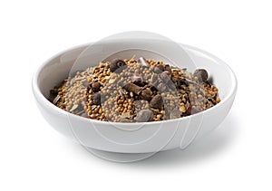 Pickling spices in a plate placed on a white background