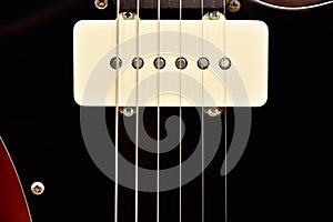 Pickup six string electric guitar close-up
