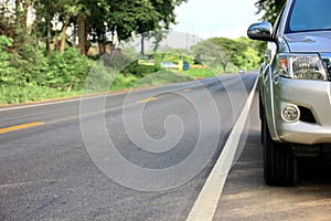 pickup truck park on empty highway ,head light  lamp of one ton truck