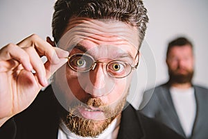 Picky smart inspector. Man handsome bearded guy wear eyeglasses. Eye health and sight. Optics and vision concept. Smart