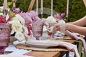 Picnic aesthetics table setting, flowers arrangement. Arrangement for party planning and decoration.