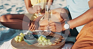 Picnic, alcohol and hands of couple on beach with champagne toast for anniversary, love and date. Nature, food and