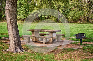 Picnic area with table and grill in the park