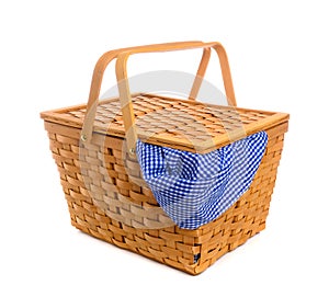 Picnic basket with blue gingham, checked cloth