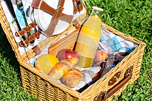 Picnic Basket With Fruits, Juice And Croissants