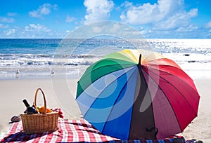 Picnic basket with fruits by the ocean