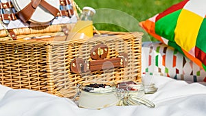 Picnic Basket With Fruits, Orange Juice, Croissants And No Bake Blueberry And Strawberry Cheesecake