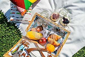 Picnic Basket With Fruits, Orange Juice, Croissants And No Bake Blueberry And Strawberry Cheesecake