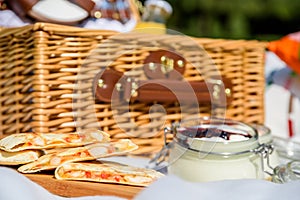 Picnic Basket With Fruits, Orange Juice, Croissants, Quesadilla And No Bake Blueberry And Strawberry Cheesecake