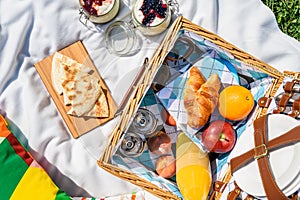 Picnic Basket With Fruits, Orange Juice, Croissants, Quesadilla And No Bake Blueberry And Strawberry Cheesecake