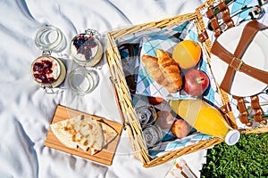 Picnic Basket With Fruits, Orange Juice, Croissants, Quesadilla And No Bake Blueberry And Strawberry Cheesecake