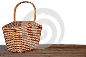 Picnic Basket Or Hamper On Wooden Table Isolated