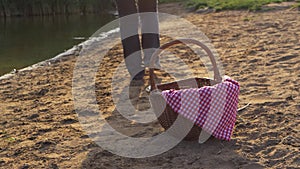 Picnic basket by the lake shore