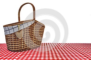 Picnic Basket On The Red Checkered Tablecloth Isolated On White