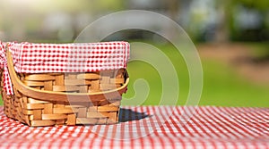 Picnic basket on a table with a red tablecloth. Summer mood. relaxation. holidays
