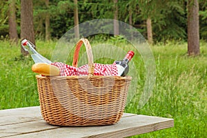 Picnic basket in a woodland setting