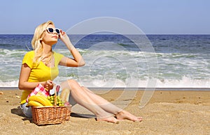 Picnic on the Beach. Blonde Young Woman