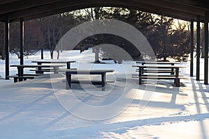 Picnic Benches at Gardiners Park during the winter with snow all over them