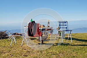 Picnic and camping equipment, table and chairs on the top of the mount